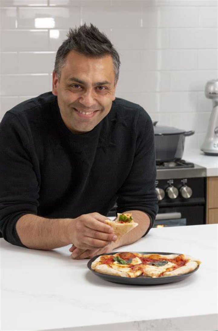 PHOTO: Chef Johnny di Francesco creating the 99-cheese pizza.